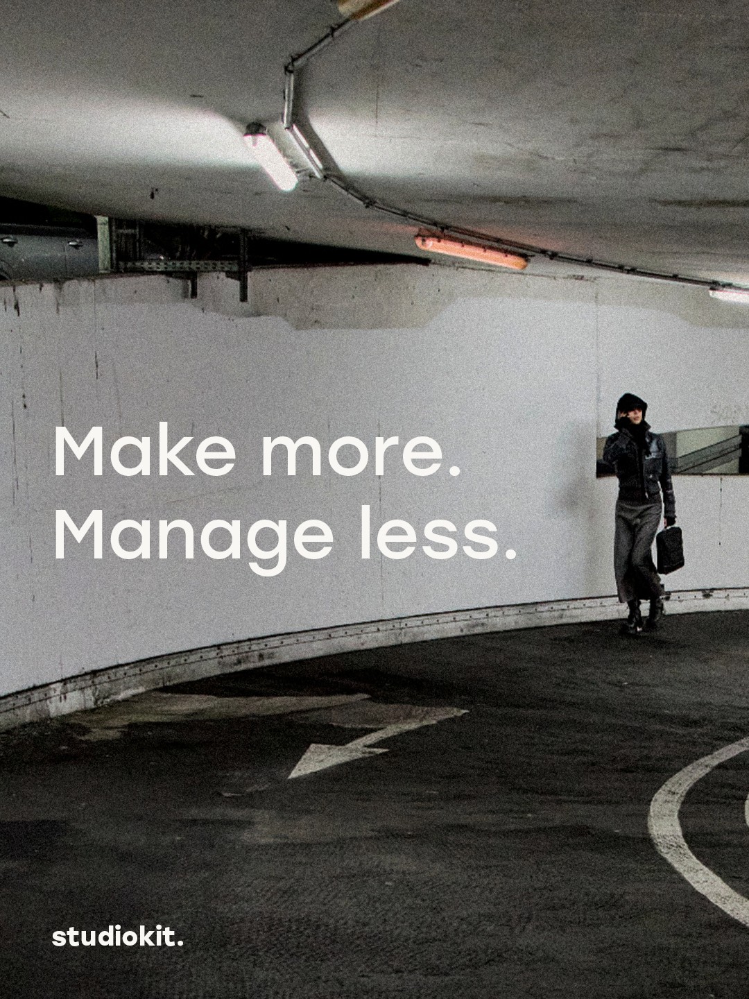 studiokit. campaign: a person walking through a parking garage. Make more. Manage less.